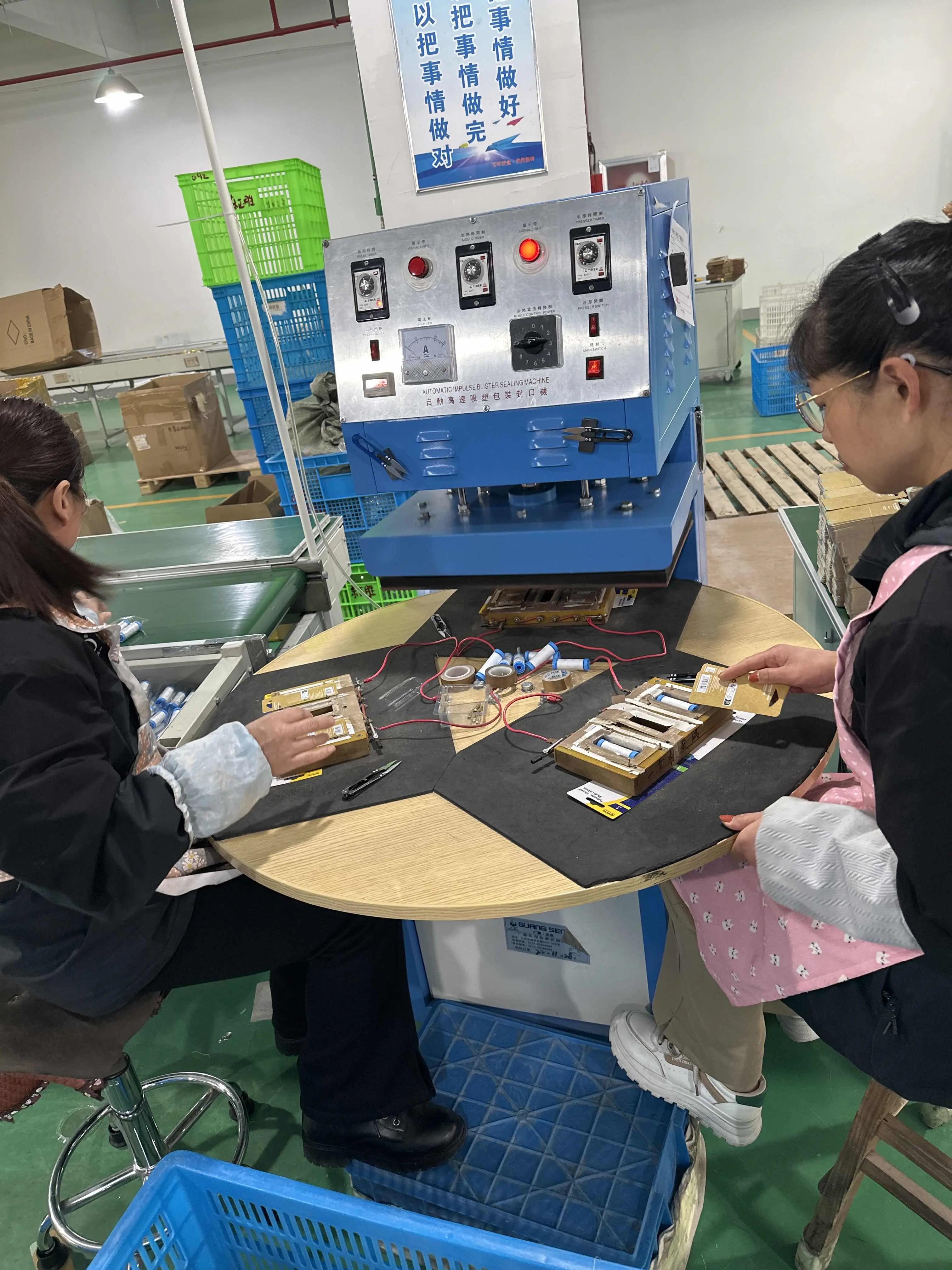 Dongzheng worker operating production equipment